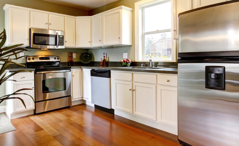 Classic white and green new kitchen with cherry floor ...